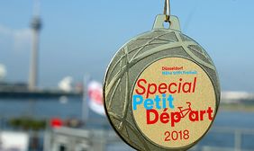 Die Medaille für die Teilnehmenden am Special Petit Depart 2018