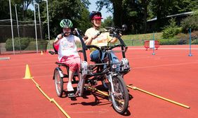 Special Petit Départ im Rather Waldstadion: Mit einem Dreirad im Geschicklichkeitsparcours